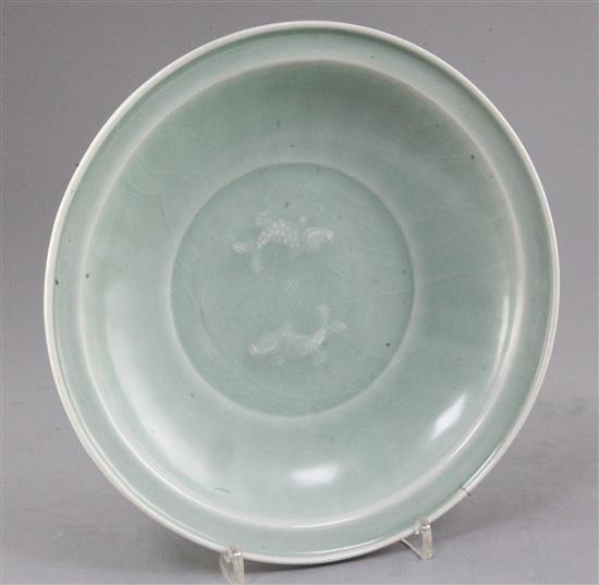 A Chinese celadon glazed twin fish dish, Song dynasty style, 25cm